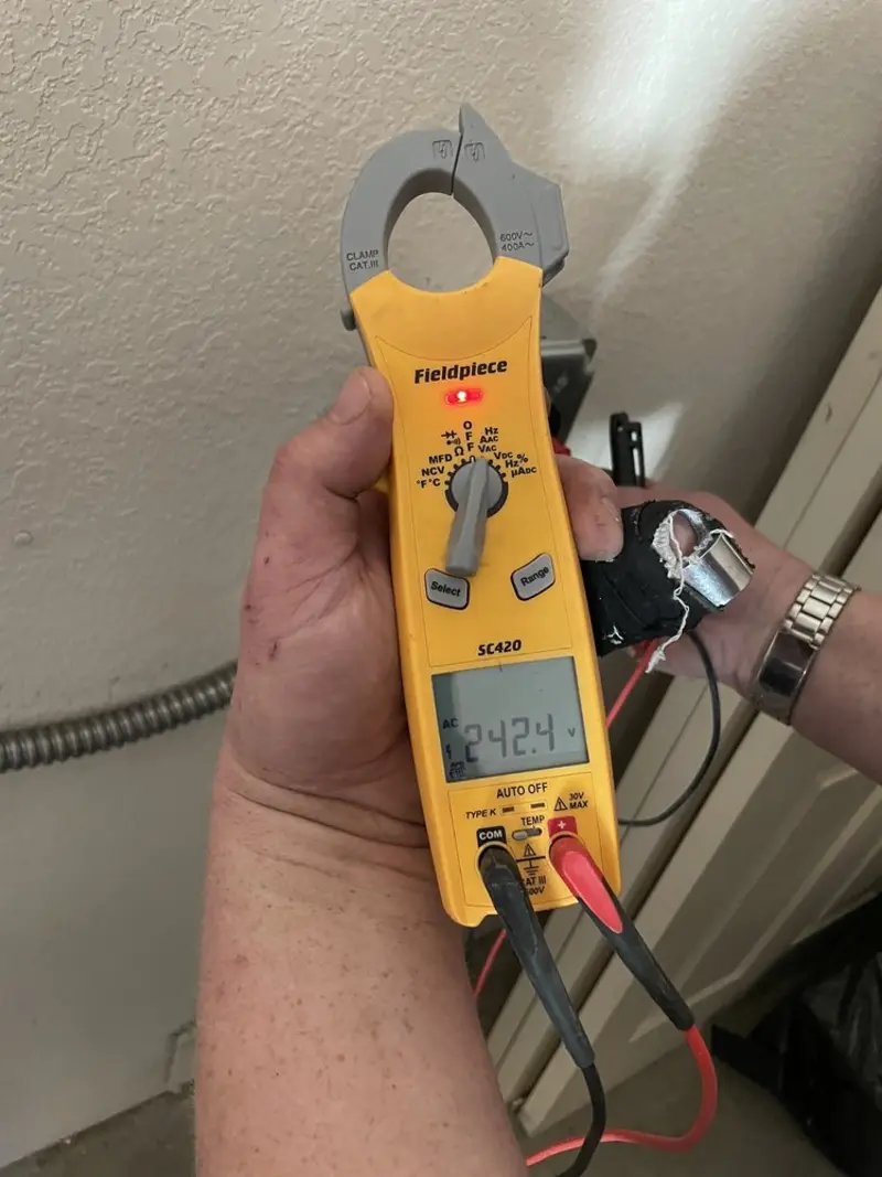 Voltage testing with clamp meter during Ceiling Fan Installation in Gouverneur
